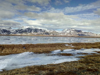 Scenic view of snowcapped icelandic mountains against sky