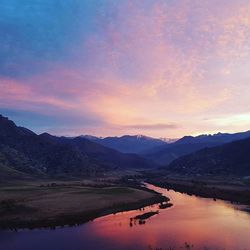 Scenic view of lake at sunset