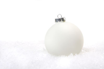 Close-up of snow on white background