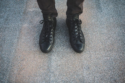 Low section of man standing on floor