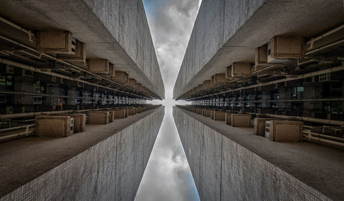 Directly below shot of buildings against sky