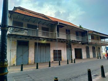 Facade of old building against sky