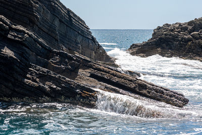 Waves on rocks on the sea