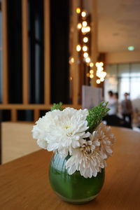 Close-up of white flower vase on table