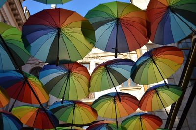 Low angle view of colorful umbrellas hanging outdoors