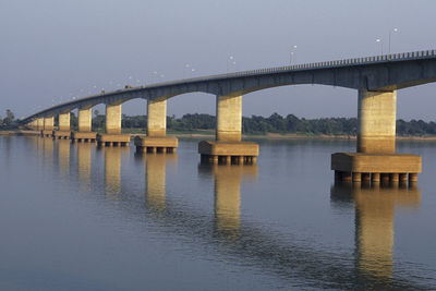 Bridge over river against clear sky