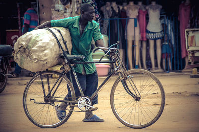 Rear view of man riding bicycle