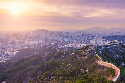 Cityscape against sky during sunset