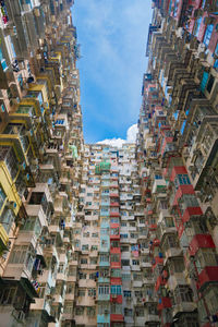 Low angle view of buildings against sky in city