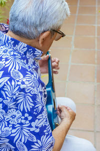 Rear view of a man holding woman