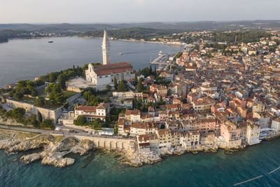 High angle view of townscape by sea