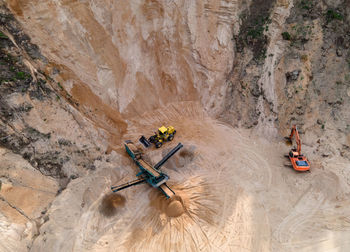 High angle view of people on rock