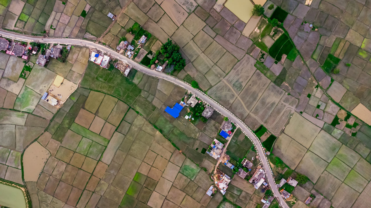 HIGH ANGLE VIEW OF PEOPLE IN SWIMMING POOL