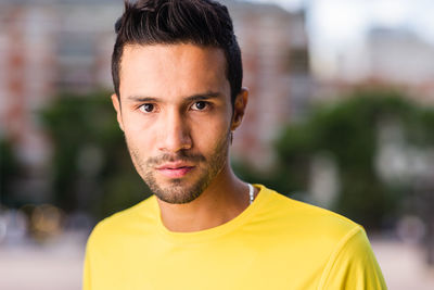 Portrait of young man standing outdoors