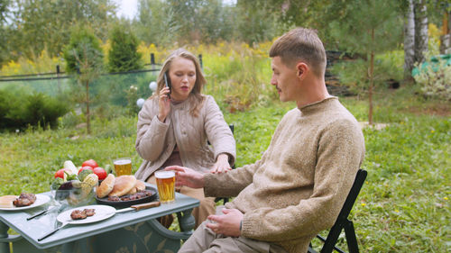 Couple having lunch outdoors