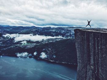 Man jumping on a cliff