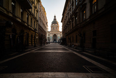 Alley amidst buildings against sky in city