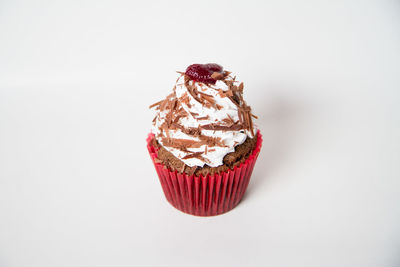 Close-up of cupcake against white background