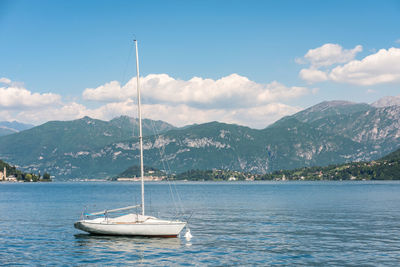 Sailboat in sea against sky