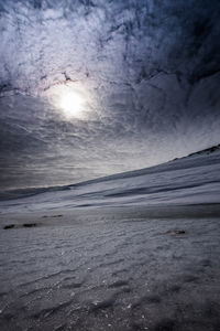 Scenic view of snowcapped landscape against sky during sunset