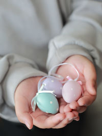 Midsection of woman holding easter eggs