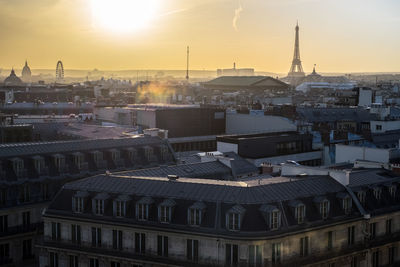 High angle view of buildings against sky during sunset