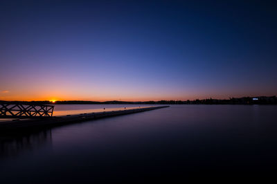 Scenic view of lake at dusk