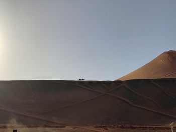 Scenic view of desert against clear sky