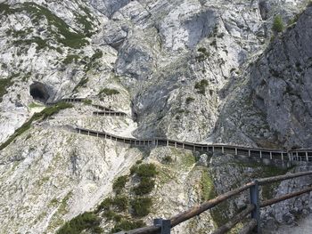 Bridge over river against mountain