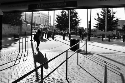 People walking on sidewalk in city