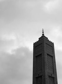 Low angle view of building against cloudy sky