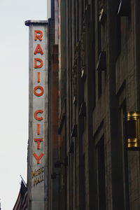 Low angle view of text on building