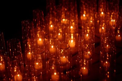 Low angle view of illuminated candles