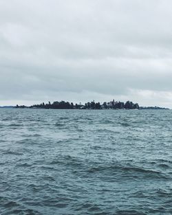 Scenic view of sea against cloudy sky