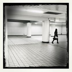 Woman standing in corridor