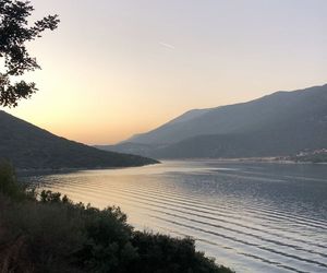 Scenic view of lake against clear sky during sunset