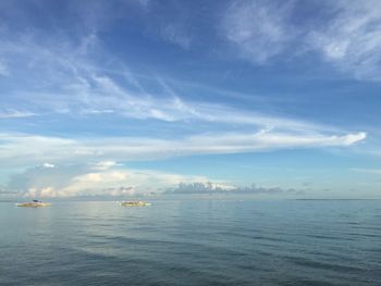 Scenic view of sea against cloudy sky