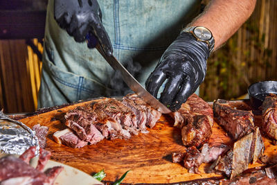 Cropped hand of person preparing food