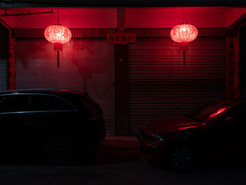 Illuminated lamp in city at night