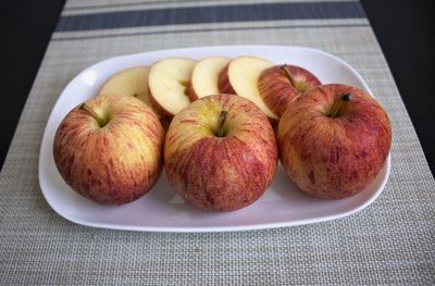 High angle view of apples in plate on table