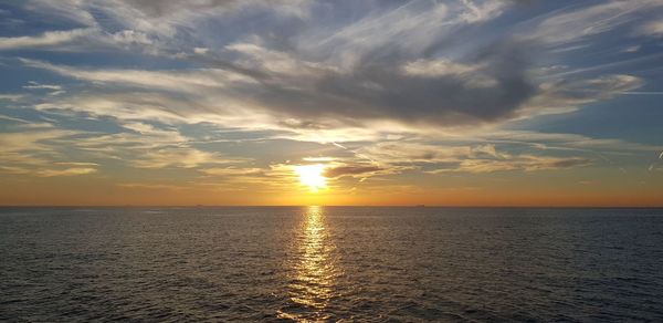 Scenic view of sea against sky during sunset