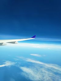 Aerial view of airplane flying in sky