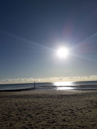 Scenic view of beach against sky during sunset