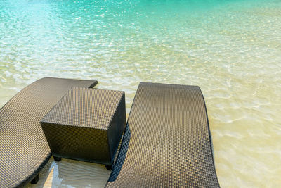 High angle view of chairs on beach