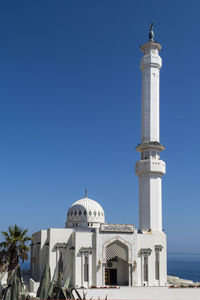 Low angle view of building against blue sky