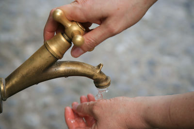 Cropped image of person cleaning hands