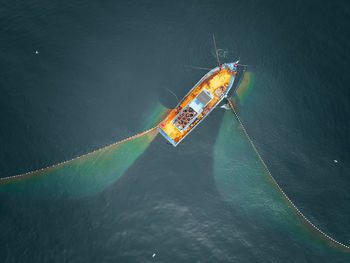 High angle view of ship sailing on sea