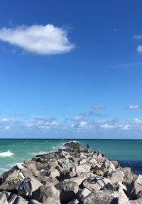 Scenic view of sea against cloudy sky