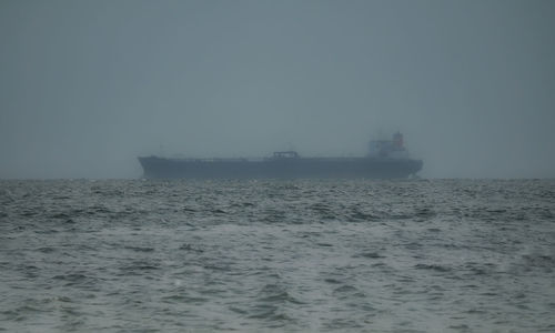 Scenic view of sea against sky during foggy weather