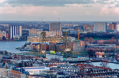 Aerial view of the city in the golden hour with noordereiland  and the bridges across koningshaven